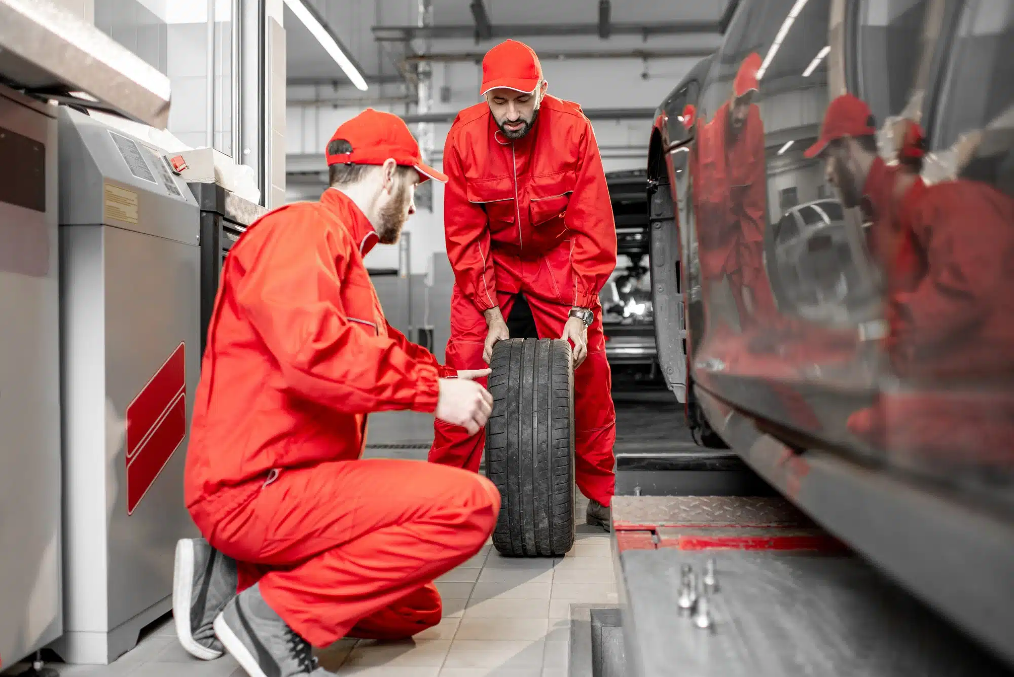 workers changing wheels